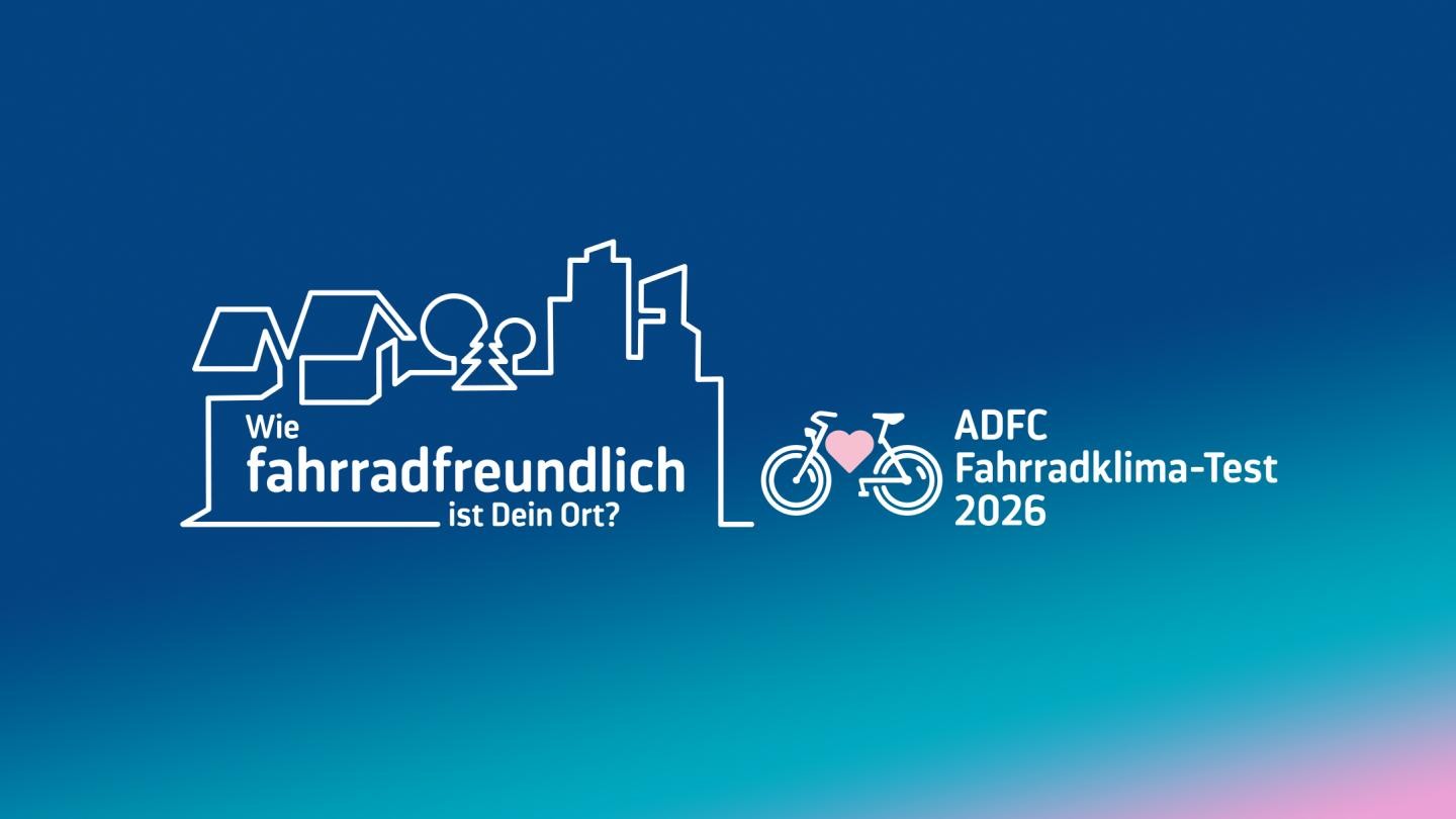 Eine Stadtsilhouette und ein Rad mit einem Herz